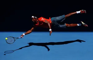 Tennis Prints: Print of Gael Monfils in mid-air during a tennis match