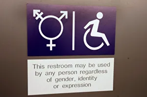 A sign is seen on a gender neutral toilet during the World Economic Forum annual meeting A sign is seen on a gender neutral toilet during the World Economic Forum annual meeting