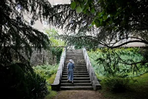 A sister, member of the Clarisses community, walks in the garden of Saint Clare Monastery A sister, member of the Clarisses community, walks in the garden of Saint Clare Monastery