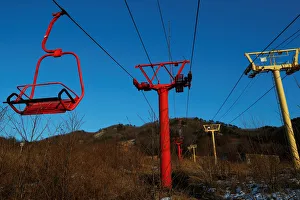 Ski lift chairs hang at the abandoned Alps Ski Resort located near the demilitarized zone Ski lift chairs hang at the abandoned Alps Ski Resort located near the demilitarized zone
