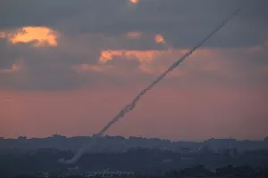 Smoke trails are seen as rockets are launched from the Gaza Strip towards Israel as seen Smoke trails are seen as rockets are launched from the Gaza Strip towards Israel as seen