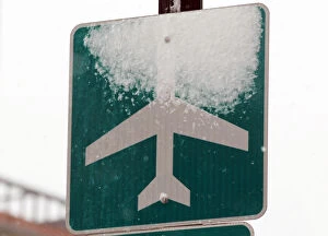 Images Dated 27th December 2010: Snow covers a sign marking the route to Logan Airport during a snowstorm in Boston