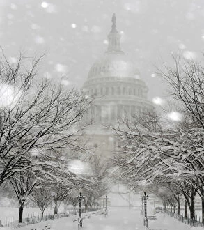 Images Dated 6th February 2010: Snow falls on the grounds of the U.S. Capitol as a blizzard blankets Washington
