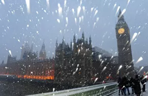 Images Dated 6th January 2010: Snow falls around The Houses of Parliament in central London