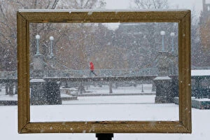 Images Dated 17th January 2018: Snow falls through a picture frame in the Boston Public Garden during a winter storm in