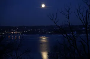 The full Snow moon rises above the Hudson River and the town of Irvington in The full Snow moon rises above the Hudson River and the town of Irvington in