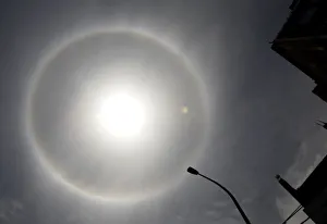 A solar halo, an optical phenomenon that appears around the Sun, is photographed in Lima A solar halo, an optical phenomenon that appears around the Sun, is photographed in Lima