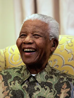 Former South African President Nelson Mandela laughs during an interview with the Former South African President Nelson Mandela laughs during an interview with the