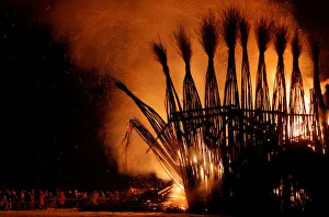 Spectators look at the burning installation during a performance devoted to Maslenitsa in Spectators look at the burning installation during a performance devoted to Maslenitsa in