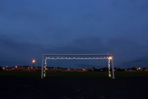 Prints of In a photograph taken using long exposure, a goalpost is illuminated by a flashlight at the Harpurs Hill housing estate in the town of Coleraine May 28, 2014 Coleraine Prints: Print of a goalpost illuminated by flashlight in long exposure