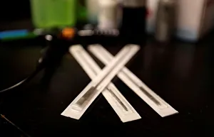 Stainless steel needles lie on a desk in a tattoo studio in Prague Stainless steel needles lie on a desk in a tattoo studio in Prague