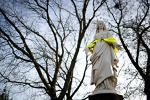 A statue of the Virgin Mary wears a yellow vest in a street in Nantes A statue of the Virgin Mary wears a yellow vest in a street in Nantes