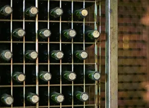 Stored bottles lay in a wine cellar during season of grape harvest in La Rioja Stored bottles lay in a wine cellar during season of grape harvest in La Rioja