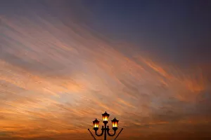Street lamp is seen at sunset in Valletta