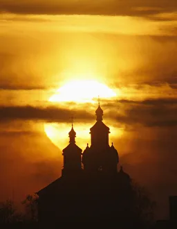 The sun rises above an Orthodox Church in the town of Novogrudok The sun rises above an Orthodox Church in the town of Novogrudok