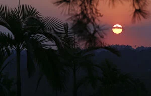 Sunlight Gallery: The sun sets over the hills near Japans team base camp in the town of Itu