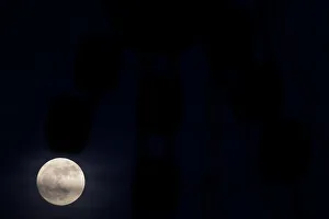 The supermoon full moon is seen rising behind an advertising billboard in Ronda The supermoon full moon is seen rising behind an advertising billboard in Ronda