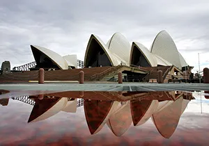 Sydneys landmark Opera House is reflected in a pool of rain water March 31, 2005 Sydneys landmark Opera House is reflected in a pool of rain water March 31, 2005