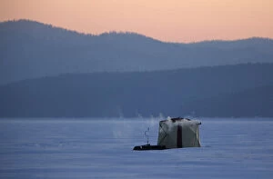 Images Dated 27th January 2018: A tent of fishermen is seen on the ice-covered Yenisei River during sunset in the