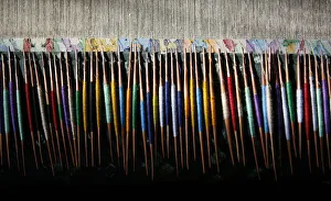 Threads are seen rolled on shaped twigs called Tooji at loom in Roshanabad Threads are seen rolled on shaped twigs called Tooji at loom in Roshanabad