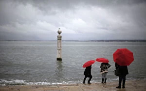 Images Dated 15th January 2014: Tourists visit the Cais das Colunas in front of the Tagus River in Lisbon