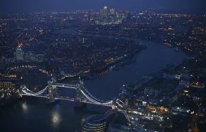 Tower Bridge and the Canary Wharf financial district are seen at dusk in an aerial Tower Bridge and the Canary Wharf financial district are seen at dusk in an aerial