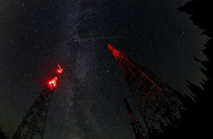 A trace of the Perseid meteor is seen over telecommunication masts in Krasnoyarsk Region A trace of the Perseid meteor is seen over telecommunication masts in Krasnoyarsk Region