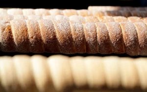 Tasty Gallery: Traditional Trdelnik sweet pastries are prepared at a market in Prague