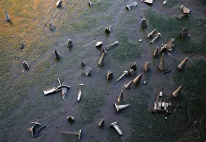 Traffic cones are seen on the bank of the River Thames during low tide in London Traffic cones are seen on the bank of the River Thames during low tide in London