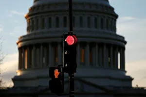 A traffic light shines red after President Donald Trump and the U.S A traffic light shines red after President Donald Trump and the U.S