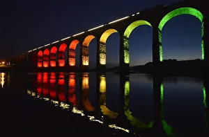 A train is reflected in the River Tweed as it crosses the Royal Border Bridge at dusk A train is reflected in the River Tweed as it crosses the Royal Border Bridge at dusk