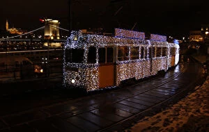 Images Dated 3rd December 2010: A tram decorated with Christmas lights travels in the centre of Budapest