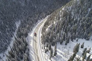 A truck drives along the R257 federal highway in the Western Sayan Mountains in A truck drives along the R257 federal highway in the Western Sayan Mountains in