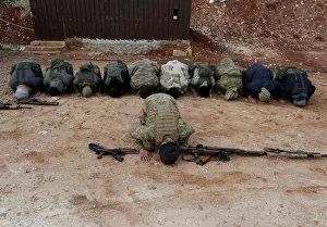 Turkey-backed Free Syrian Army fighters pray at a training camp in Azaz Turkey-backed Free Syrian Army fighters pray at a training camp in Azaz