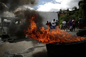 Tyres burn as truck owners block the BR-324 highway during a protest against high diesel Tyres burn as truck owners block the BR-324 highway during a protest against high diesel