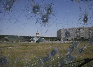 A Ukrainian border post is seen through bullet holes in a trucks windscreen on the A Ukrainian border post is seen through bullet holes in a trucks windscreen on the