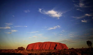 Images Dated 21st April 2014: Uluru is lit by the setting sun in the Northern Territory in central Australia