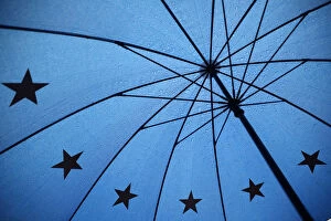 Abstracts Gallery: An umbrella with the pattern of the EU flag is seen outside the Houses of Parliament
