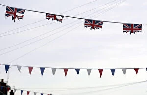 Images Dated 8th January 2013: Union flags and coloured bunting hang above a street in South Belfast