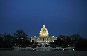 The U.S. Capitol Building is seen across a reflecting pool before President Bush delivers