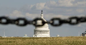 Images Dated 30th September 2013: U.S. Capitol is photographed behind a chain fence in Washington