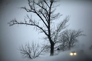 Vehicles drive through blizzards near Lehliu railway station Vehicles drive through blizzards near Lehliu railway station
