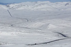 Russia Gallery: Vehicles drive along the R257 federal highway north of Kyzyl