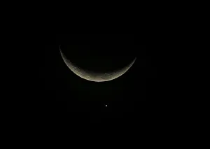 A view of the crescent moon and planet Venus in the sky over Buenos Aires A view of the crescent moon and planet Venus in the sky over Buenos Aires