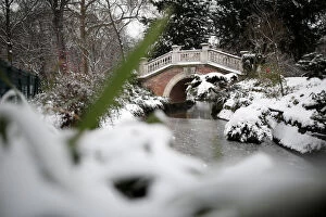 A view shows a bridge in the Parc Monceau as winter weather bringing snow