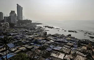 A view of a slum is seen along a seashore in Mumbai