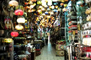 A visitor looks at traditional light-shop in local souq at Bab al Bahrain in Manama