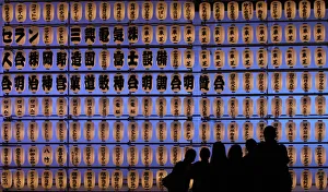 Visitors take pictures in front of paper lanterns during the Autumn Grand Festival Visitors take pictures in front of paper lanterns during the Autumn Grand Festival