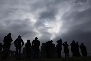 Visitors view the solar eclipse is seen over Stonehenge on Salisbury Plain, Salisbury Visitors view the solar eclipse is seen over Stonehenge on Salisbury Plain, Salisbury