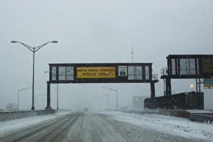 A warning alert is seen on a display as cars drive along the New Jersey Turnpike during a A warning alert is seen on a display as cars drive along the New Jersey Turnpike during a